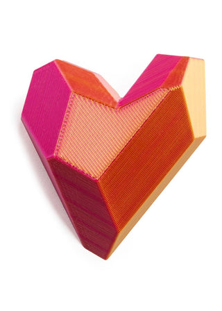 Heart-shaped object with pink and orange gradient on a white background