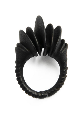 Black ring with unique design on a white background