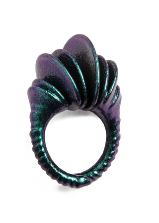 Purple and green textured ring on a white background