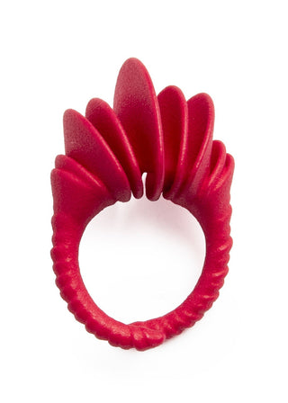 Red hair tie with fan-like design on a white background