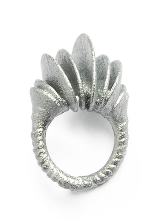 Silver ring with a unique design on a white background