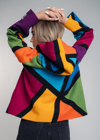 Discover our handcrafted abstract multi-color hooded jacket made of premium Burel wool. Each piece features a unique pattern, expert tailoring, and vibrant style. Perfect for bold fashion lovers.
