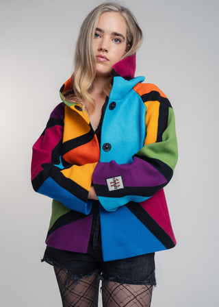 Discover our handcrafted abstract multi-color hooded jacket made of premium Burel wool. Each piece features a unique pattern, expert tailoring, and vibrant style. Perfect for bold fashion lovers.
