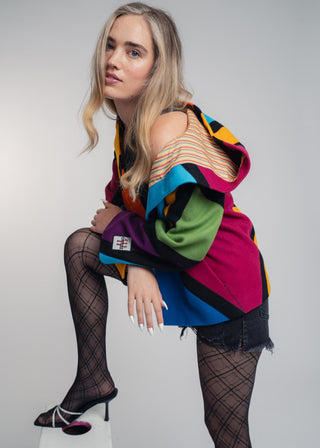 Discover our handcrafted abstract multi-color hooded jacket made of premium Burel wool. Each piece features a unique pattern, expert tailoring, and vibrant style. Perfect for bold fashion lovers.
