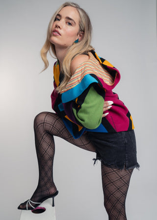 Discover our handcrafted abstract multi-color hooded jacket made of premium Burel wool. Each piece features a unique pattern, expert tailoring, and vibrant style. Perfect for bold fashion lovers.
