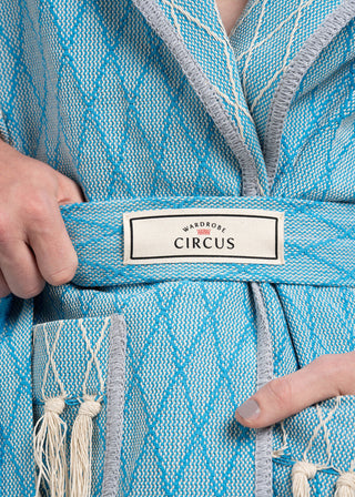 Blue textured garment with 'Wardrobe Circus' label