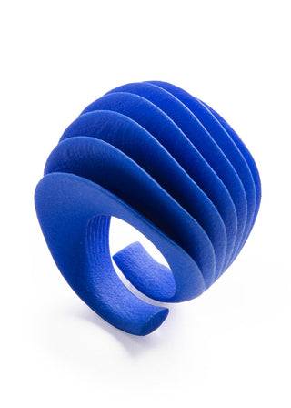 Blue ring with a ribbed texture on a white background