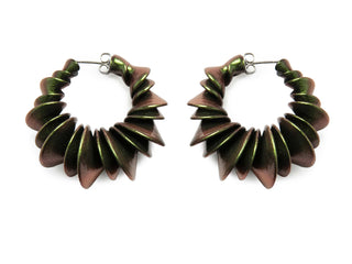 Pair of bronze and green spiral earrings on a white background