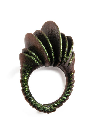 Decorative ring with green and brown design on a white background