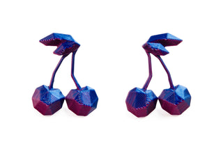 3D-printed blue and purple geometric objects on a white background