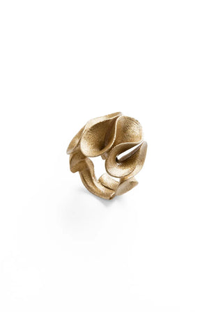 A textured gold ring with an organic, layered petal-like design, photographed on a clean white background.