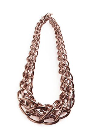 Rose gold braided necklace on a white background
