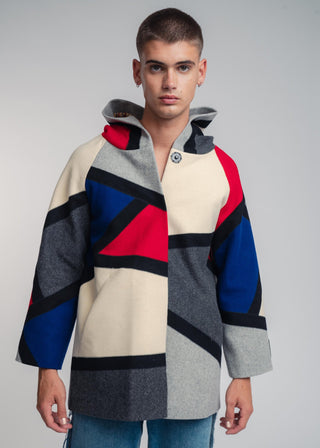 Handcrafted hooded Burel coat made from premium wool. Unique puzzle-cut design, artisan-sewn, sustainable fashion, and timeless style.