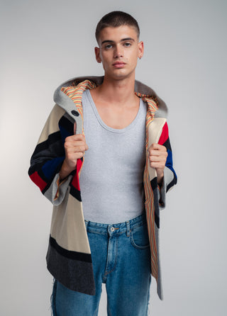 Handcrafted hooded Burel coat made from premium wool. Unique puzzle-cut design, artisan-sewn, sustainable fashion, and timeless style.