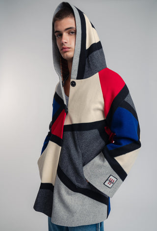 Handcrafted hooded Burel coat made from premium wool. Unique puzzle-cut design, artisan-sewn, sustainable fashion, and timeless style.