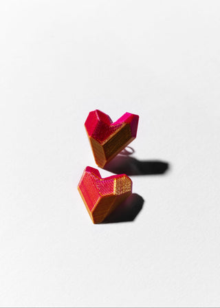 Two heart-shaped objects with a gradient color on a white background