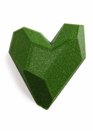 Green geometric heart-shaped object on a white background