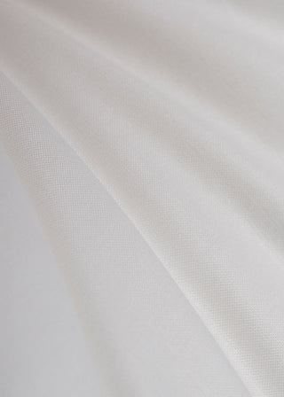 Close-up of white fabric with folds