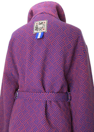 A purple hooded jacket with a red geometric pattern, shown on a mannequin against a plain white background.