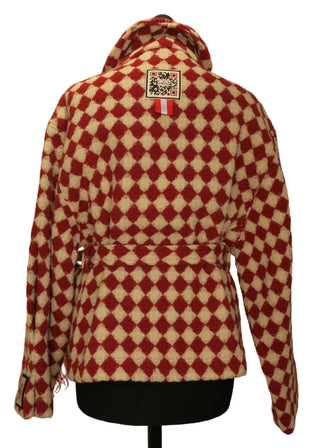 A red and cream checkered fleece jacket with a hood, displayed on a black mannequin torso against a plain beige background.