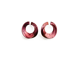 Pair of pink hoop earrings on a white background