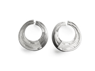 Pair of silver hoop earrings on a white background