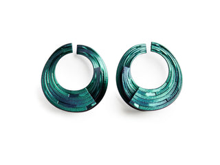 Pair of green hoop earrings on a white background