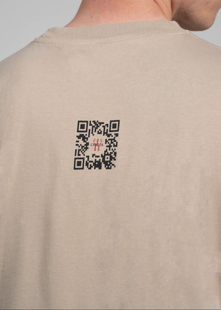 Beige t-shirt with a QR code on the back against a neutral background