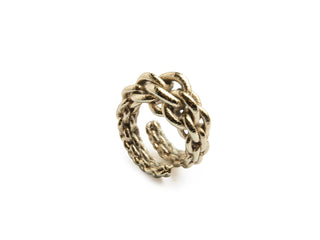 Gold braided ring on a white background