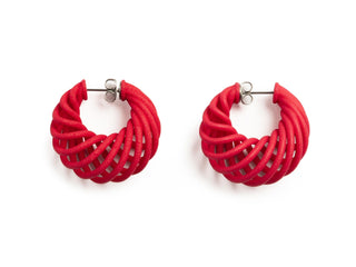 Pair of red hoop earrings on a white background