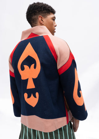 Person wearing a multi-color wool spade jacket on a white background