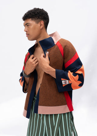 Man wearing a multi-color jacket with a white background