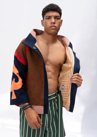 Man wearing a multi-color wool spade jacket with a white background