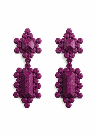 Pair of purple earrings on a white background