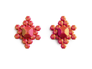 Pair of pink geometric earrings on a white background