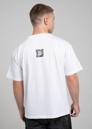 Person wearing a white t-shirt with a QR code on the back against a gray background