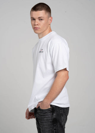 Person wearing a white t-shirt with a logo on a gray background
