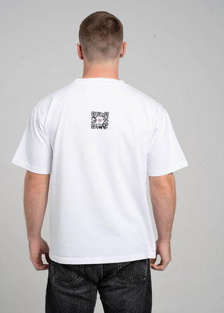 Man wearing a white t-shirt with a QR code on the back against a gray background
