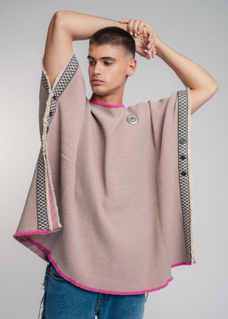 Unisex reversible poncho in premium cotton with a bold beige and pink duo-color design, featuring a bold statement button.