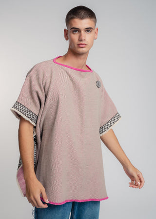 Unisex reversible poncho in premium cotton with a bold beige and pink duo-color design, featuring a bold statement button.