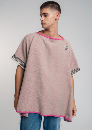 Unisex reversible poncho in premium cotton with a bold beige and pink duo-color design, featuring a bold statement button.