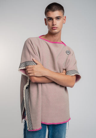 Unisex reversible poncho in premium cotton with a bold beige and pink duo-color design, featuring a bold statement button.