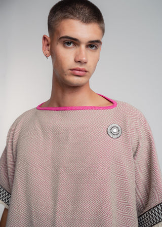 Unisex reversible poncho in premium cotton with a bold beige and pink duo-color design, featuring a bold statement button.