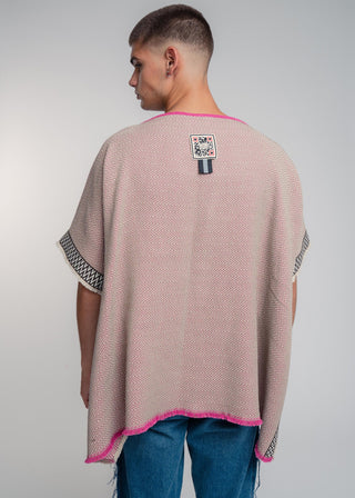 Unisex reversible poncho in premium cotton with a bold beige and pink duo-color design, featuring a bold statement button.
