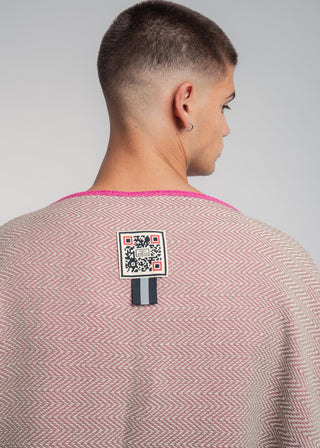 Unisex reversible poncho in premium cotton with a bold beige and pink duo-color design, featuring a bold statement button.