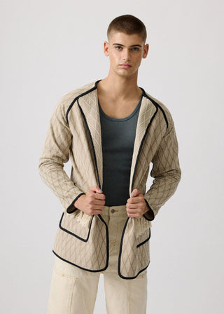 Unisex artist jacket in premium cotton with a bold beige diamond design and black finished edges.