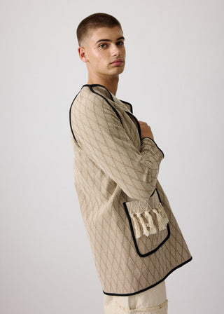 Unisex artist jacket in premium cotton with a bold beige diamond design and black finished edges.
