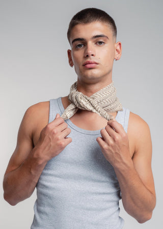 Unisex bandana in premium ultralight cotton with a bold beige and ecru duo-color design. Versatile styling accessory can be used to cover the hair, around the neck or even wrapped around the wrist as a bracelet.