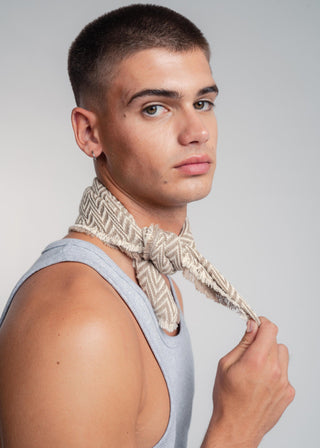 Unisex bandana in premium ultralight cotton with a bold beige and ecru duo-color design. Versatile styling accessory can be used to cover the hair, around the neck or even wrapped around the wrist as a bracelet.