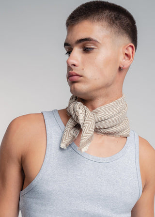 Unisex bandana in premium ultralight cotton with a bold beige and ecru duo-color design. Versatile styling accessory can be used to cover the hair, around the neck or even wrapped around the wrist as a bracelet.